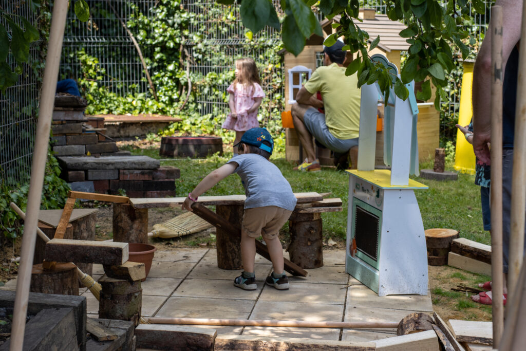 Families enjoying the Wild Play Garden.